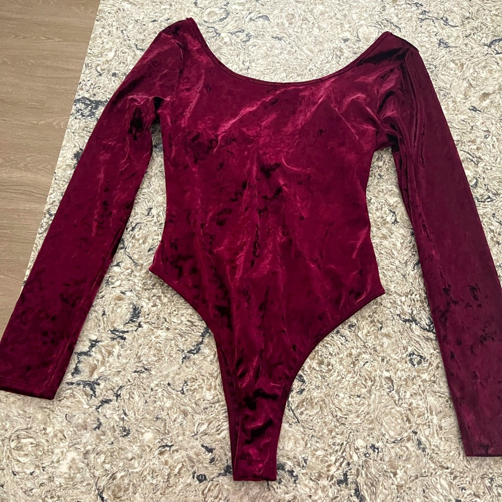 Lush velvet burgundy body suit. Women’s size medium. New with tags.
